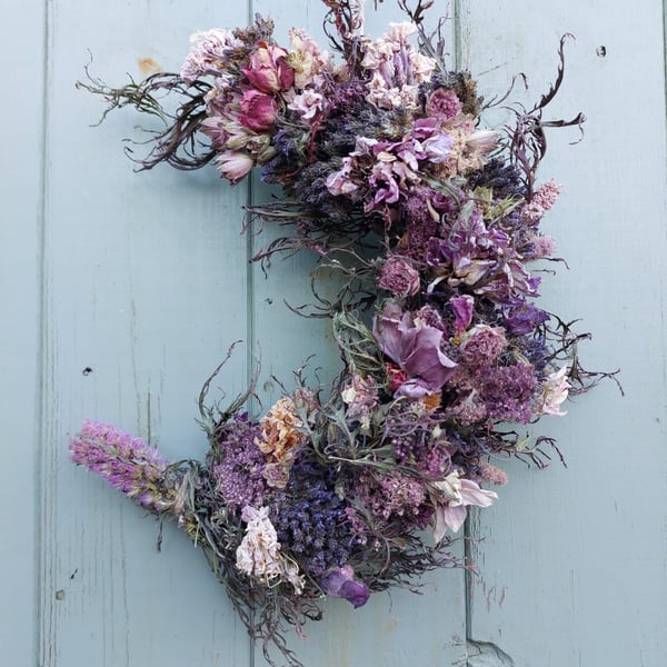 Dried Flower Crescent Moon Shape Wreath. Shades of Purple and Pink.