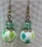Artisan green & white lampwork glass bead & crystal earrings - Image 1