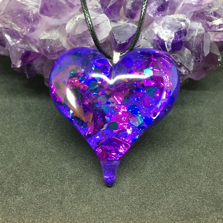 Purple glitter puffy heart pendant with black cord necklace.