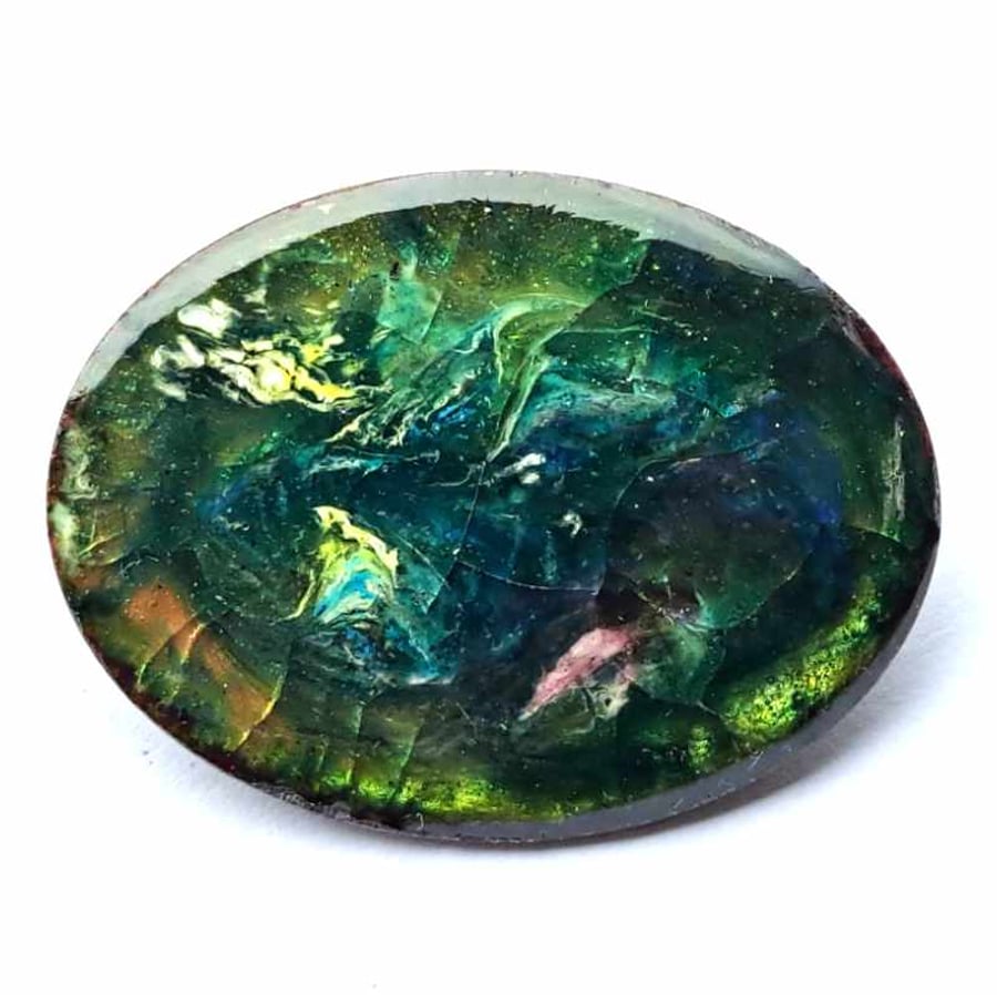 oval brooch, green over clear enamel with flecks of pink, yellow, blue and white