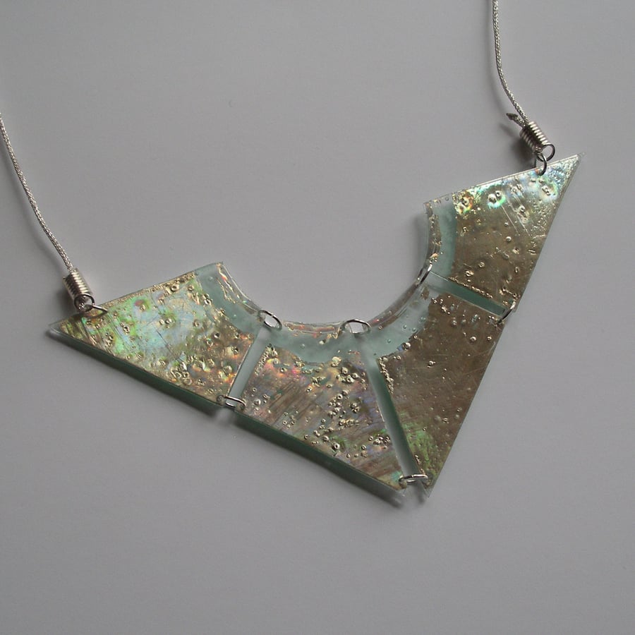 Four piece reversible silver and green-glass like necklace.