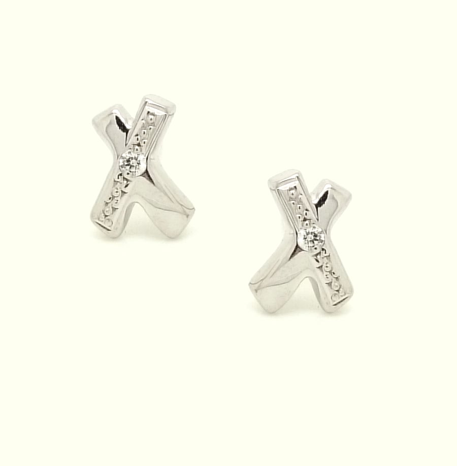 Kiss sterling silver earrings