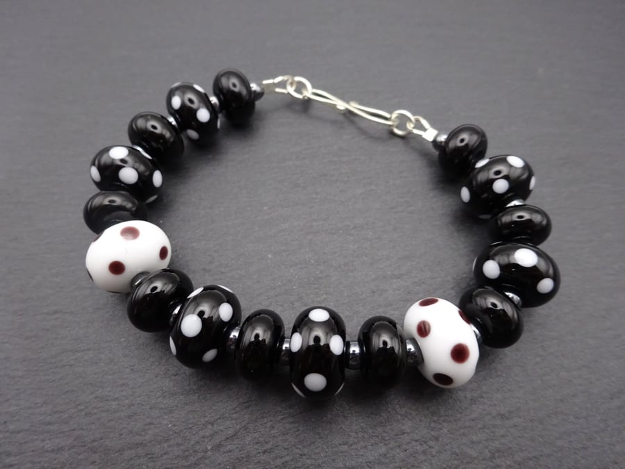 lampwork glass bracelet, sterling silver black polka dots