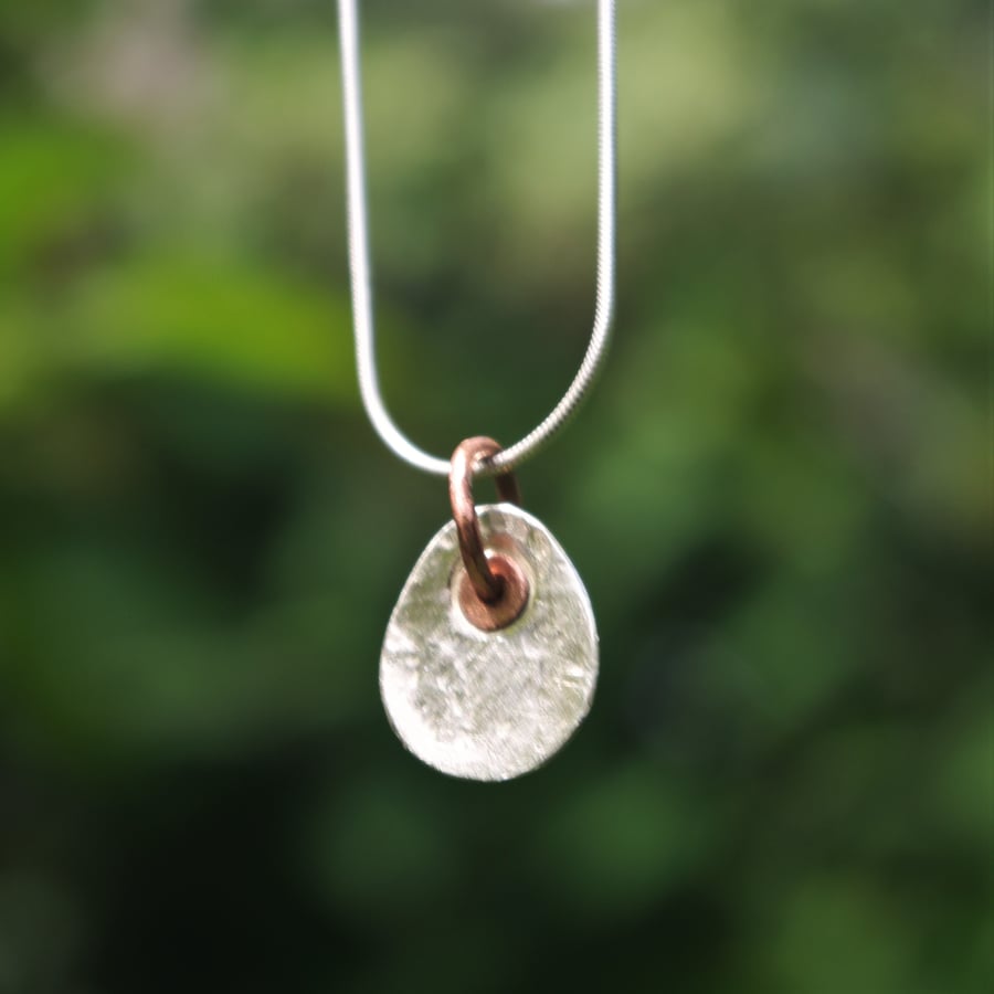 Silver and Copper Hammered Oval Pendant