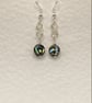 Wirework infinity symbol earrings with circular paua shell charms - Image 2