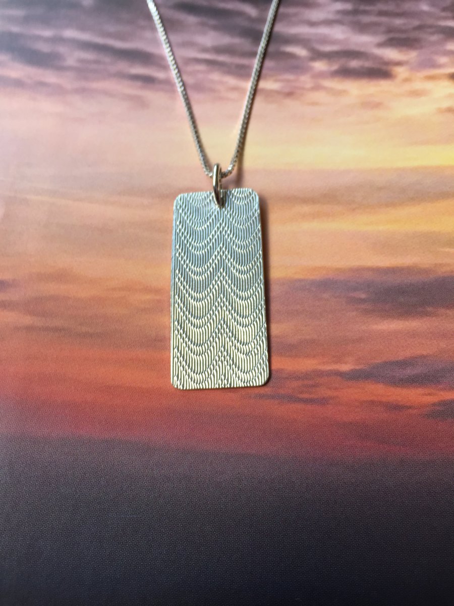 Silver swag necklace made from a cigarette case