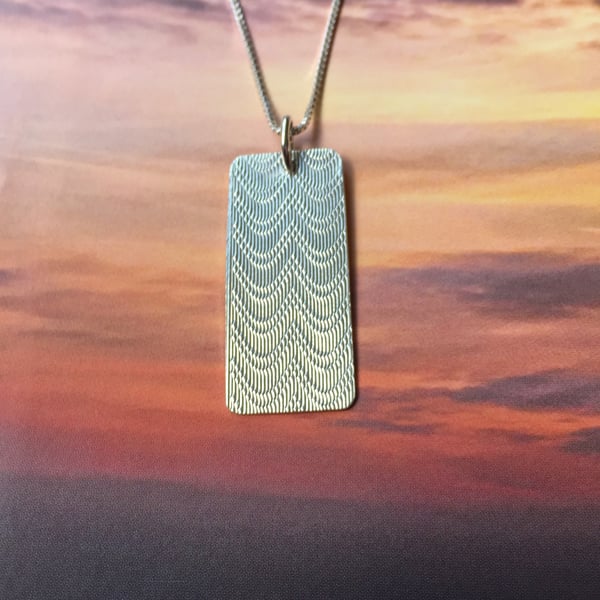 Silver swag necklace made from a cigarette case