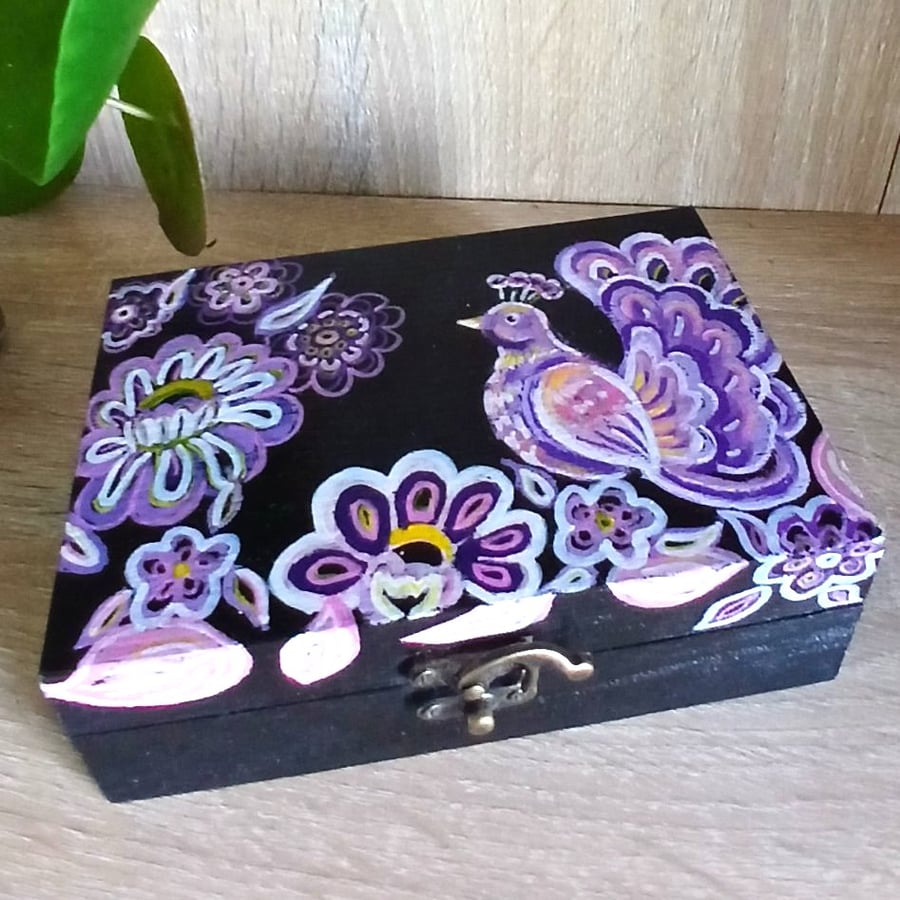 Wooden keepsake box handpainted with an ornamental bird and flowers.  