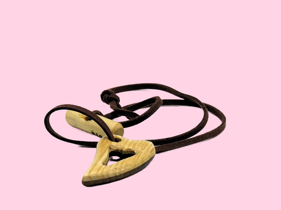 Pierced heart pendant, handcarved from two woods. SKU-N05 