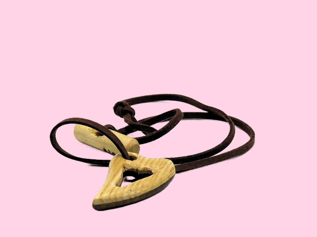 Pierced heart pendant, handcarved from two woods. SKU-N05 