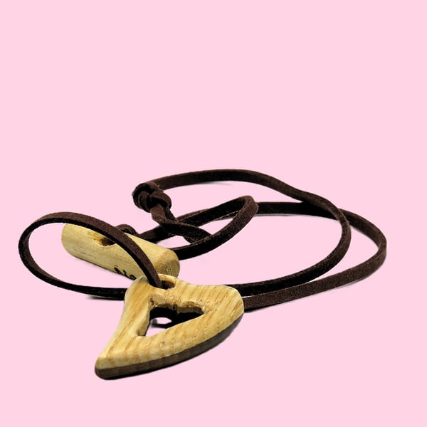 Pierced heart pendant, handcarved from two woods. SKU-N05 