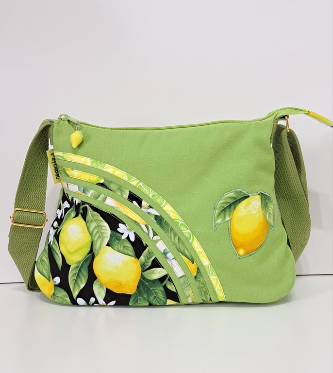Green handbag with lemons