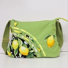 Green handbag with lemons