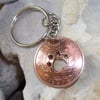 Paw in bronze halfpenny coin keyring