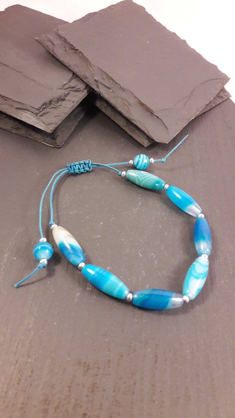 Turquoise Stripe Agate Rice Beads on Teal Cord Adjustable Bracelet