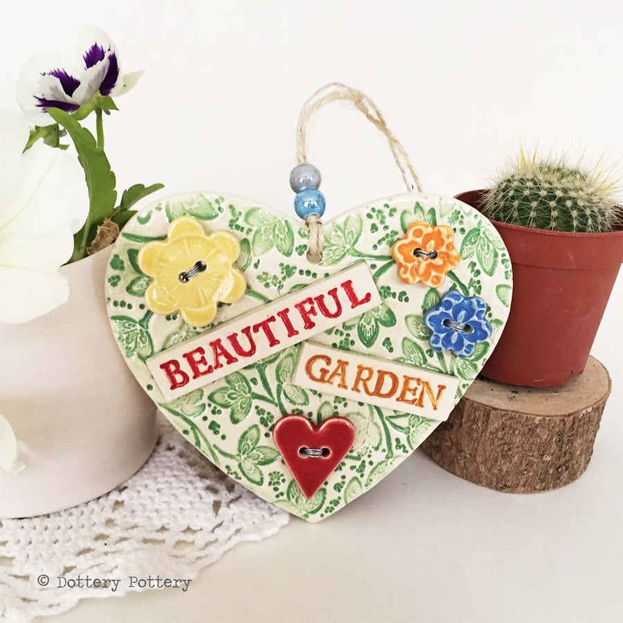 Ceramic heart decoration with button flowers Beautiful garden 