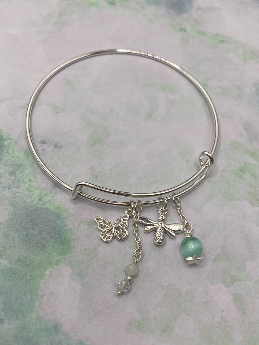 Silver plated charm bangle with green angelite and selenite stones