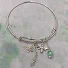 Silver plated charm bangle with green angelite and selenite stones