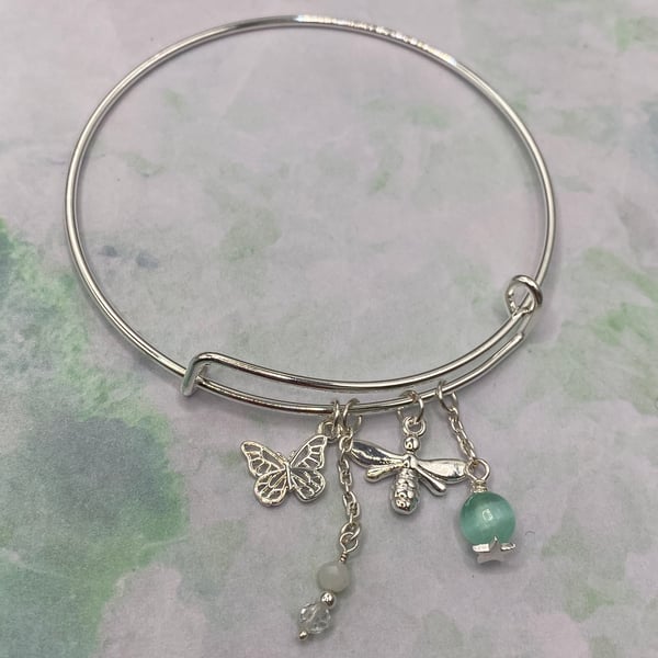 Silver plated charm bangle with green angelite and selenite stones