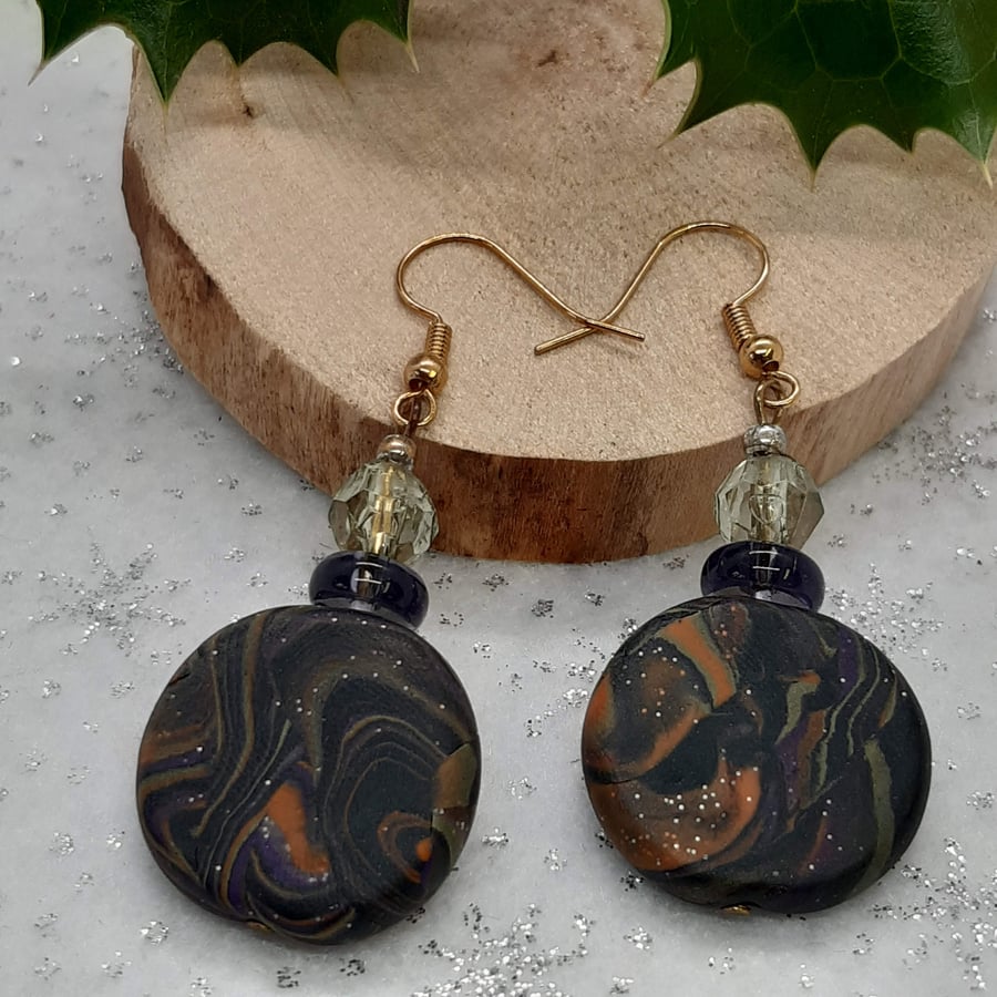 Polymer clay disc shaped dangly earrings