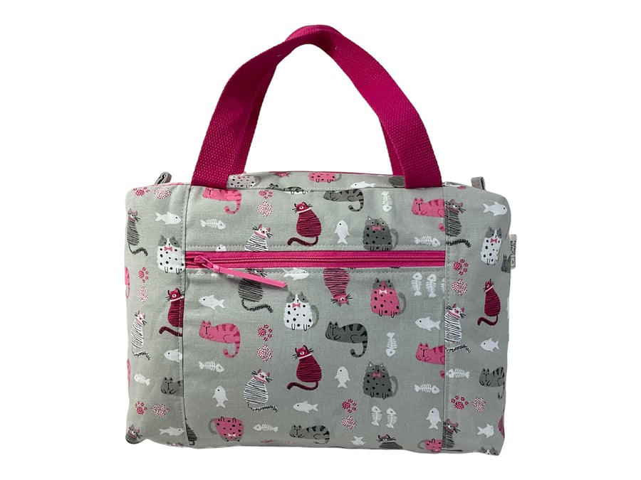 Large wash bag in cat  and mouse print, toiletries bag with handles and pocket.