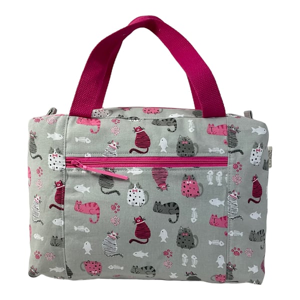 Large wash bag in cat  and mouse print, toiletries bag with handles and pocket.