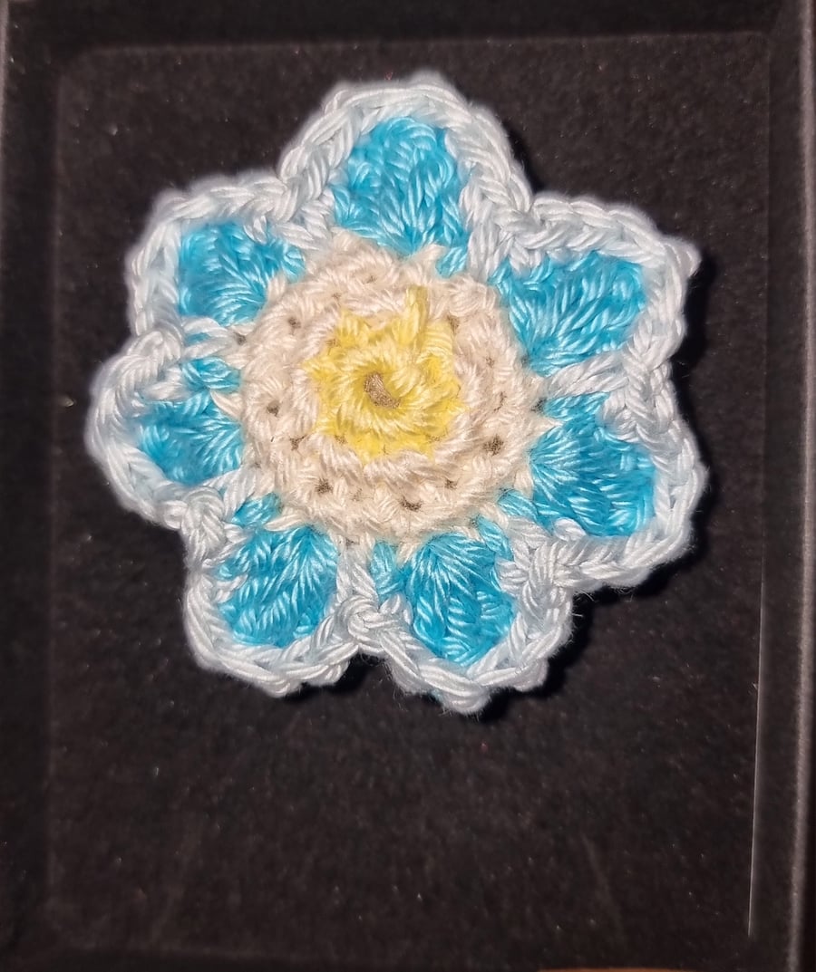 Crochet flower brooch