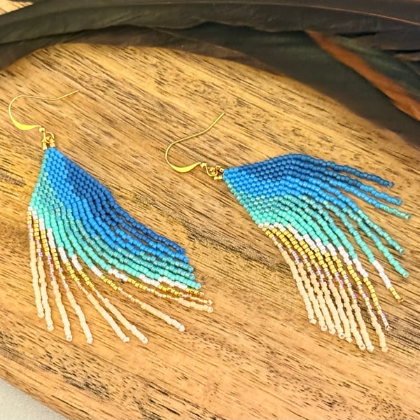 Beadwork fringe earrings in ocean blue and golden sand tones