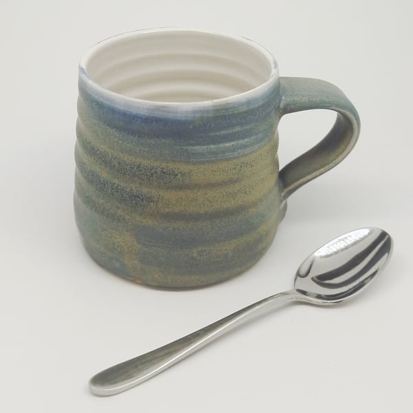 Hand-thrown, stoneware mug in "granite" glaze with a white liner M66