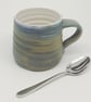 Hand-thrown, stoneware mug in "granite" glaze with a white liner M66