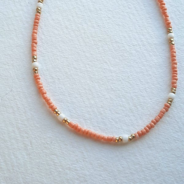 Glass beaded necklace, peach, cream and gold, 16 to 18 inches