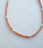 Glass beaded necklace, peach, cream and gold, 16 to 18 inches