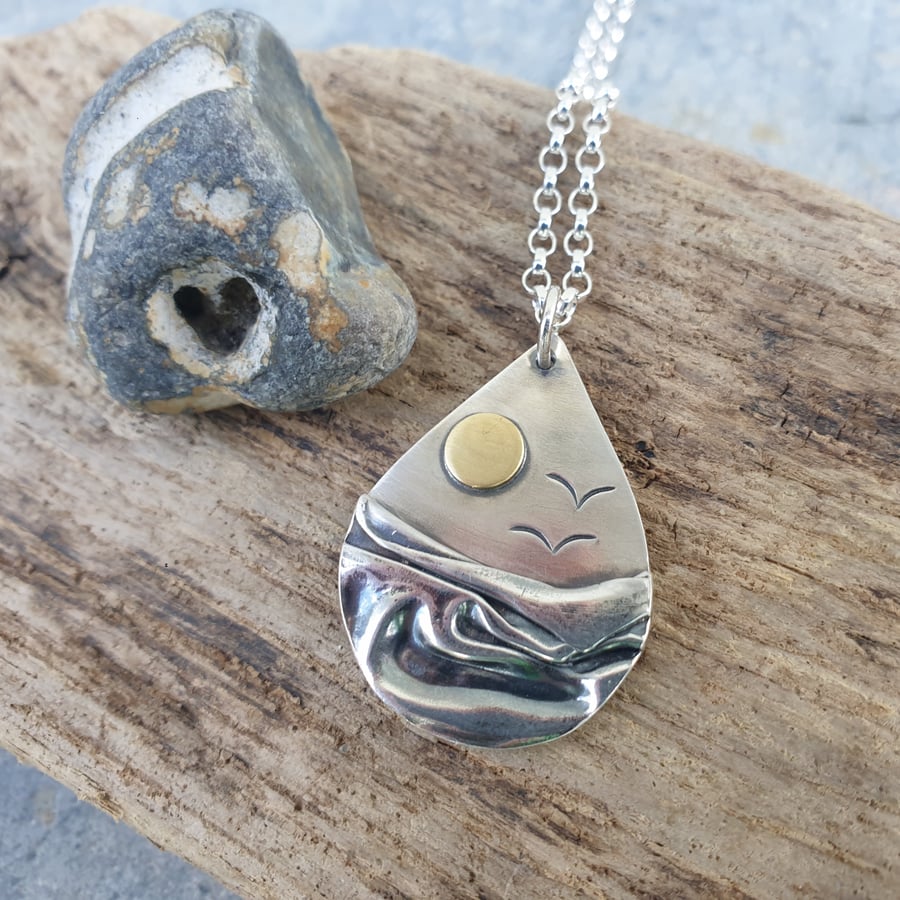 Silver beach, sea coast pendant, with brass sun and seagulls