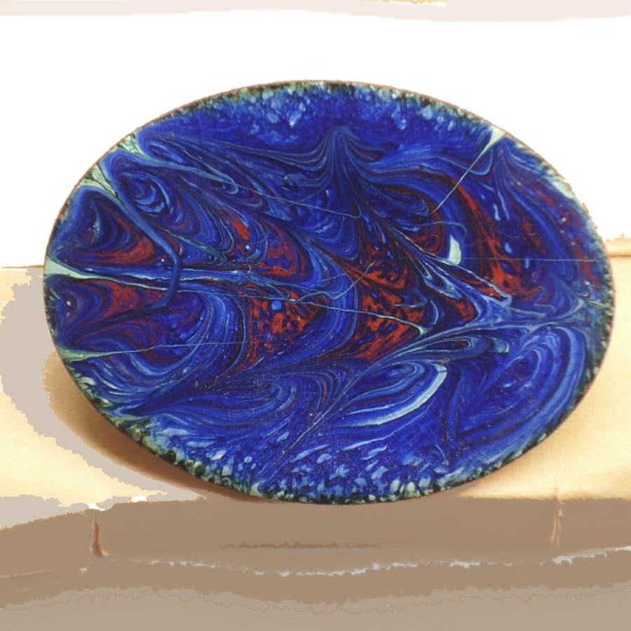 large oval brooch - scrolled red over blue and white
