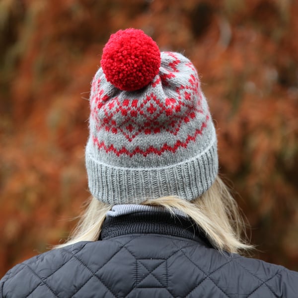 Hand knit wool bobble hat. Grey winter fairisle pompom beanie hat. 