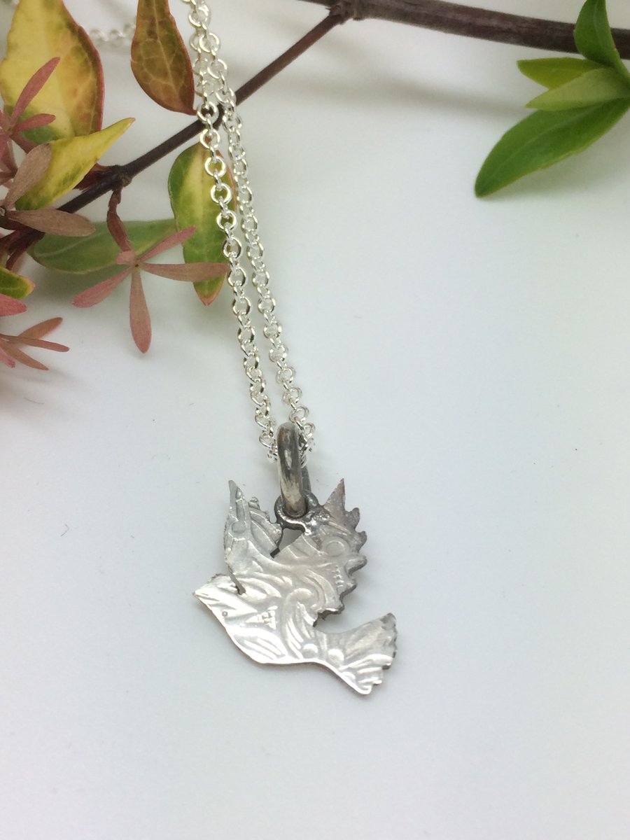 Dove charm pendant with paisley imprint