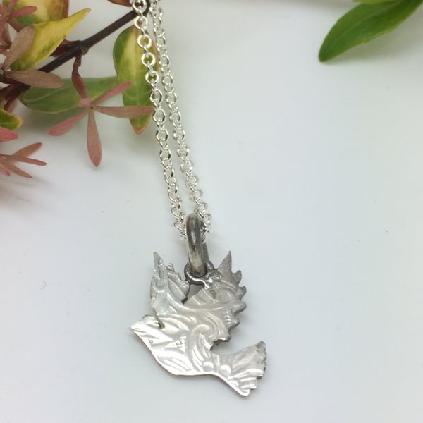 Dove charm pendant with paisley imprint