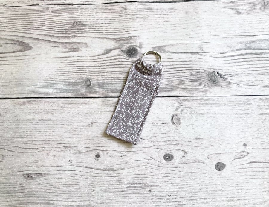 Lip balm cotton fabric keyring. Ditsy grey.
