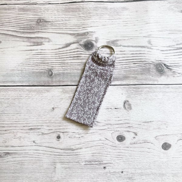 Lip balm cotton fabric keyring. Ditsy grey.