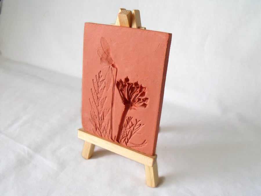 terracotta impressed clay tile displayed on an easel, number 5 of 8 available