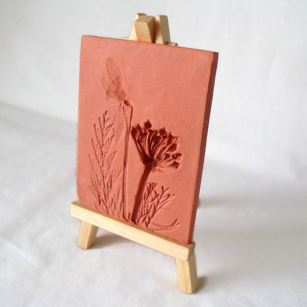 terracotta impressed clay tile displayed on an easel, number 5 of 8 available