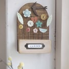 Flower Garden with Bird in Wood and Clay