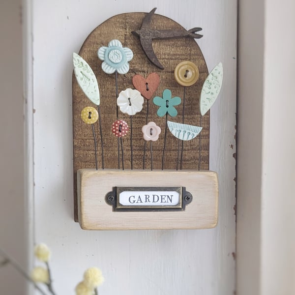 Flower Garden with Bird in Wood and Clay