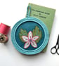 Hand Embroidered Flower in Crocheted Frame Wall Decoration  - Image 1