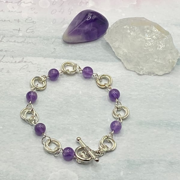 Amethyst bracelet with silver plated mobius rings 