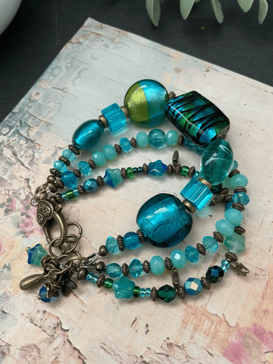 Beautiful lamp work glass beaded three stranded bohemian artisan bracelet  
