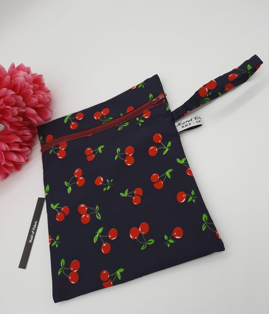 Zipped pouch,  clutch bag,  navy cherry fabric,  free uk delivery.  