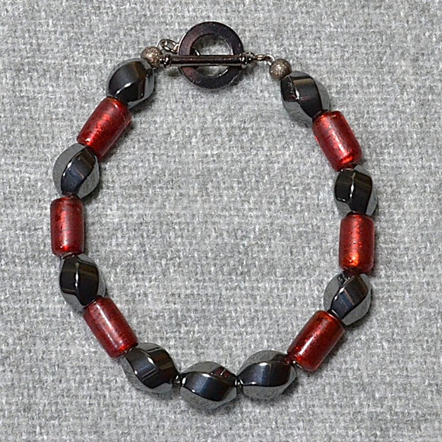 Hematite Swirl and Frosted Red Glass Tube Bead Bracelet