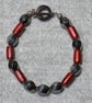 Hematite Swirl and Frosted Red Glass Tube Bead Bracelet - Image 1