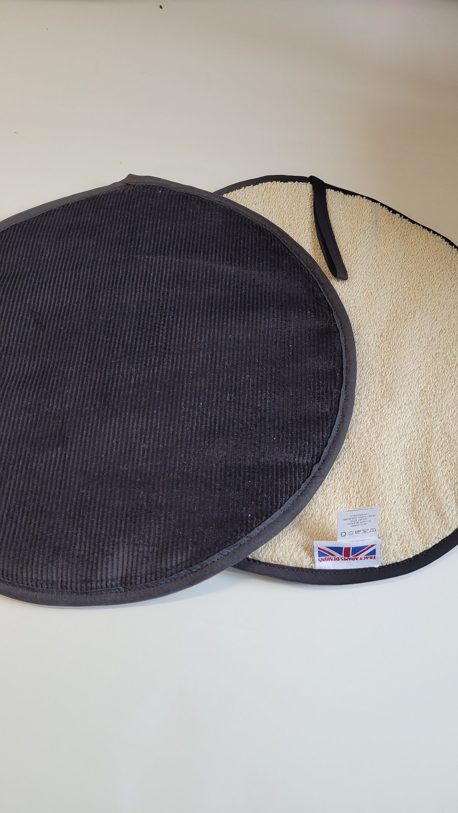 Black corduroy aga pads hob covers. . Made in England